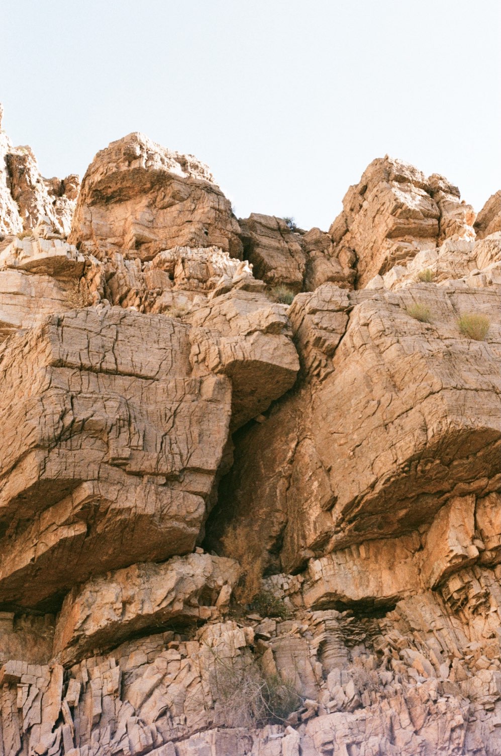Sandstone cliffs against a pale sky