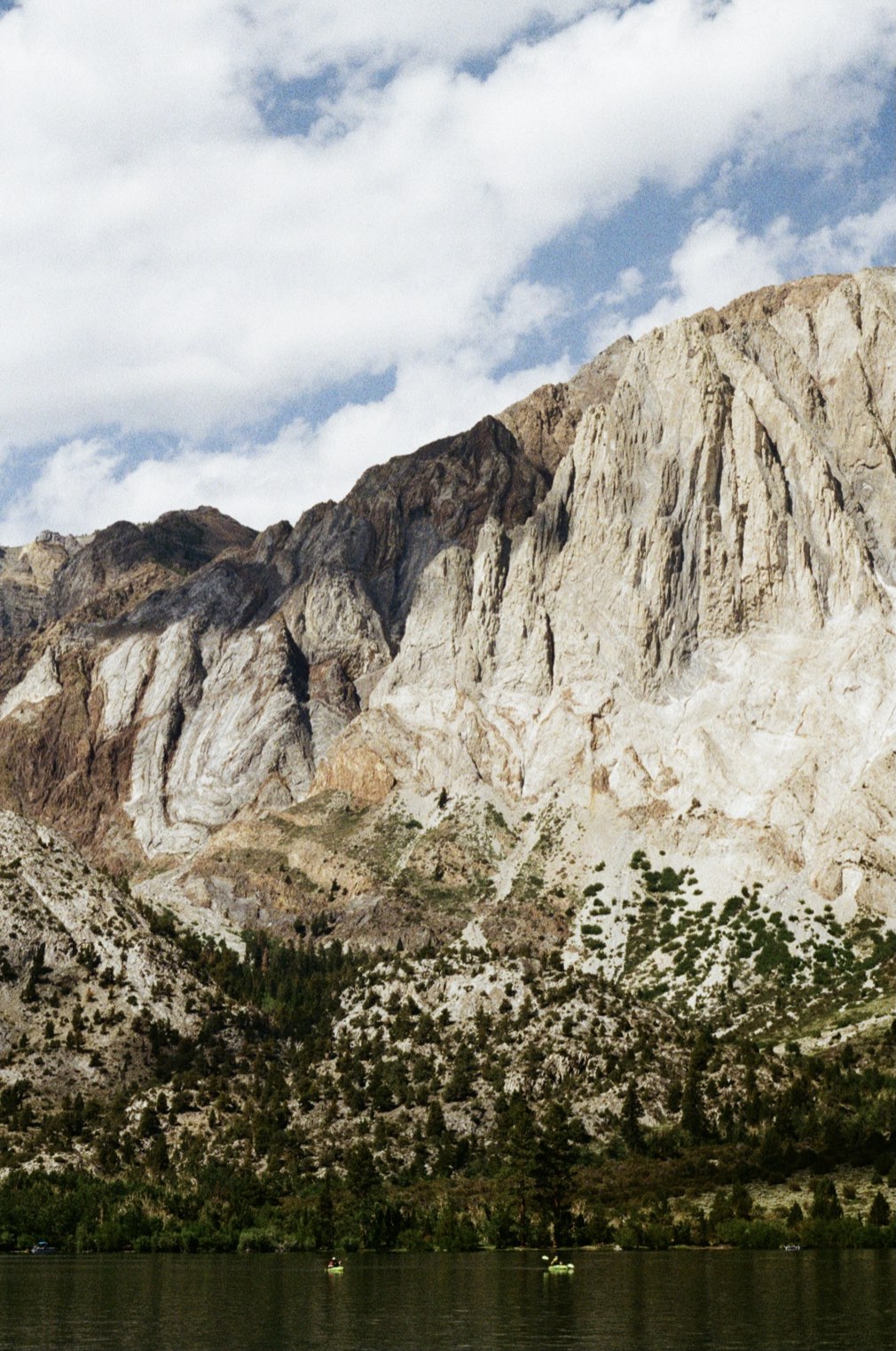 Pale granite mountains under a cloudy sky